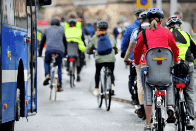 many cyclists riding on the street